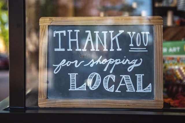 Chalkboard sign that reads Thank you for shopping local